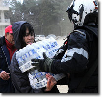 Sailor provides food and water to Japanese citizens during relief efforts. Photo: Official U.S. Navy Imagery via Flickr 
