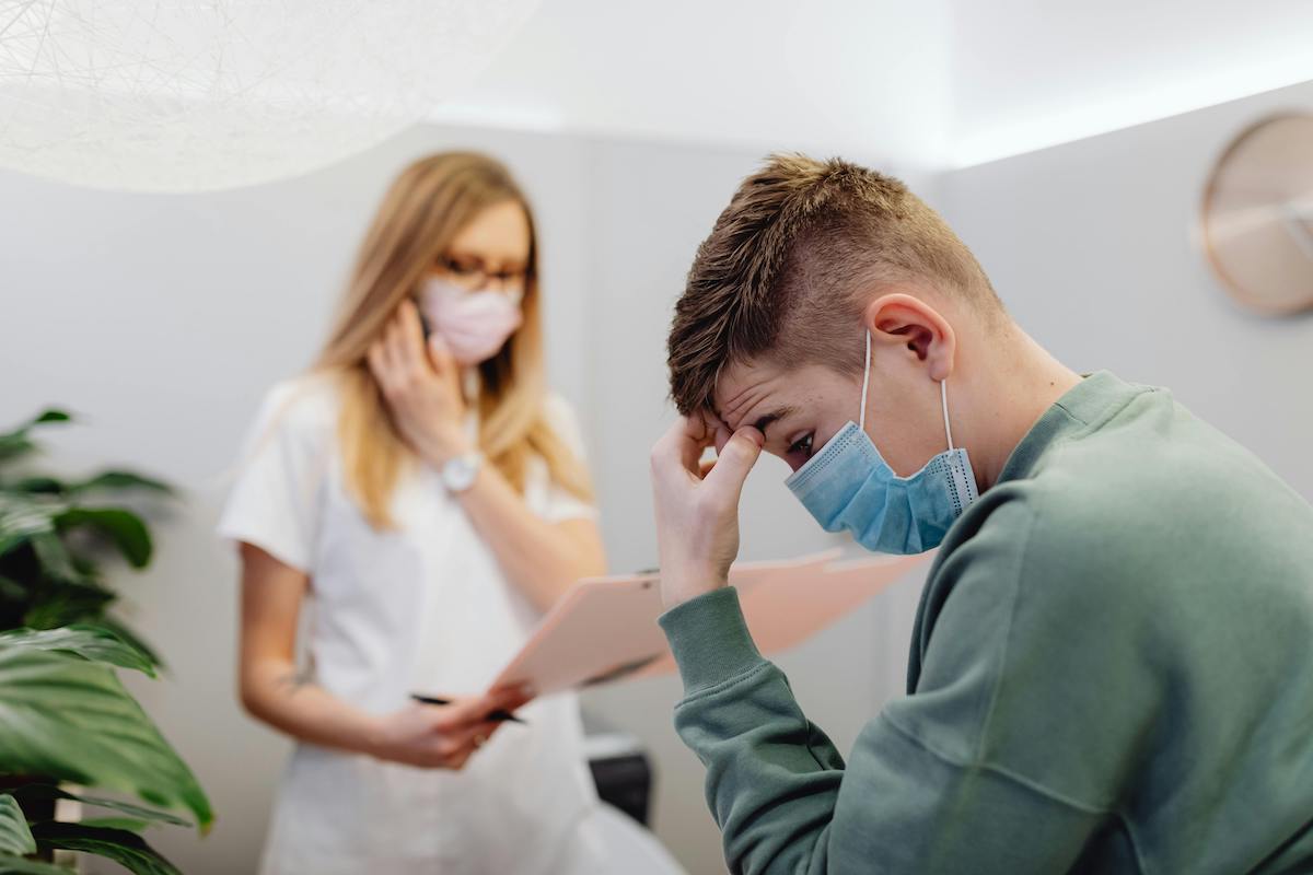 annoyed worried patient in doctor's office long wait time