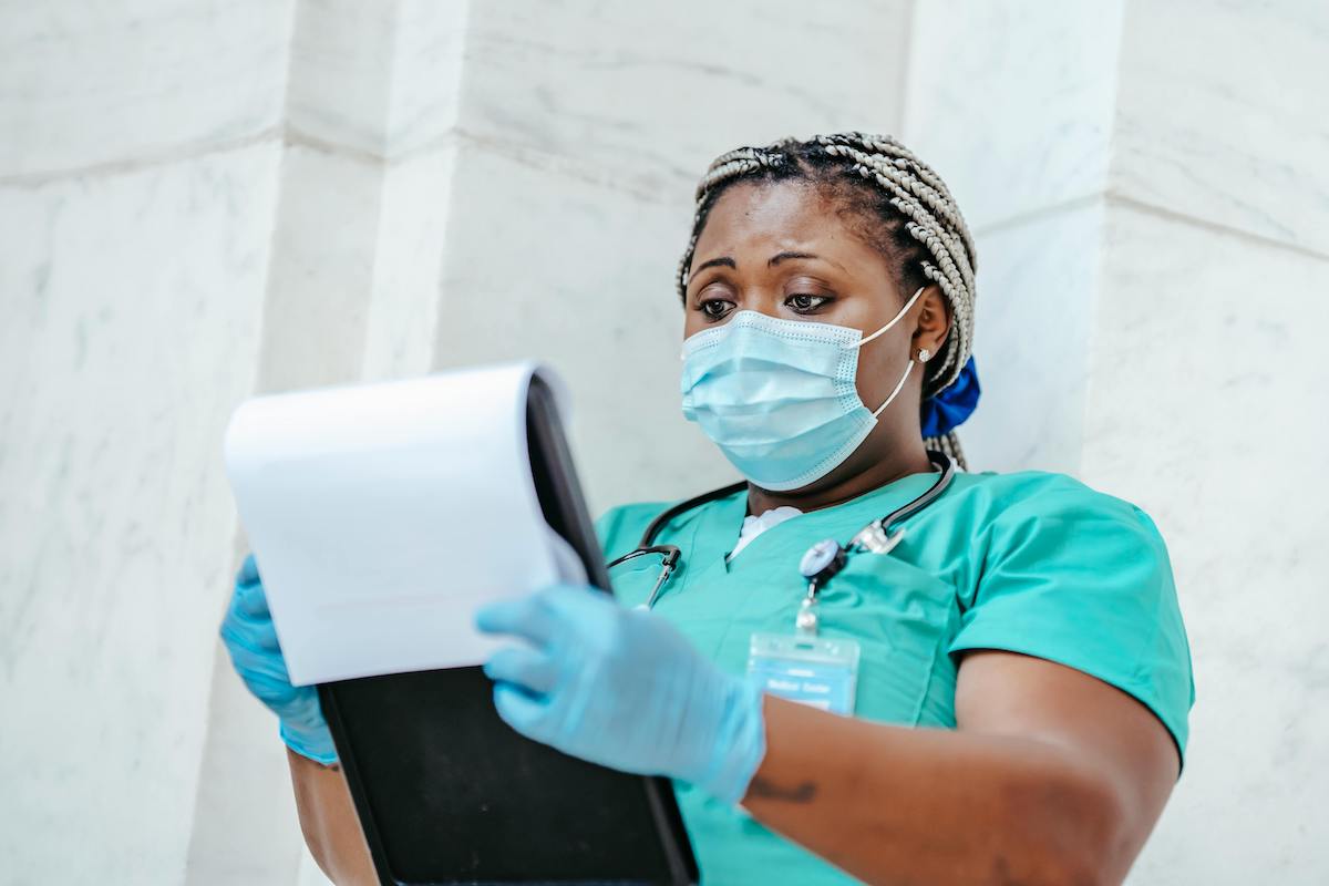 nurse holding a patient's chart