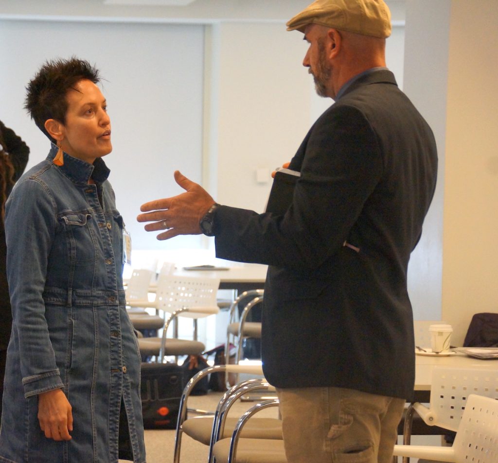 people speaking in between sessions at AHCJ's 2024 fall summit