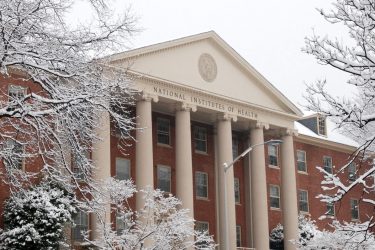James H. Shannon Building on the NIH campus in Bethesda, MD. NIH pause featured image
