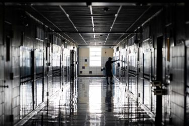 a school hallway with the lights off
