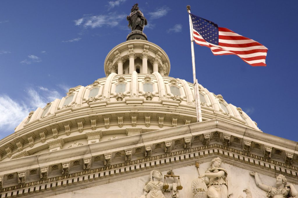 U.S. capitol dome and flag | health insurance featured img
