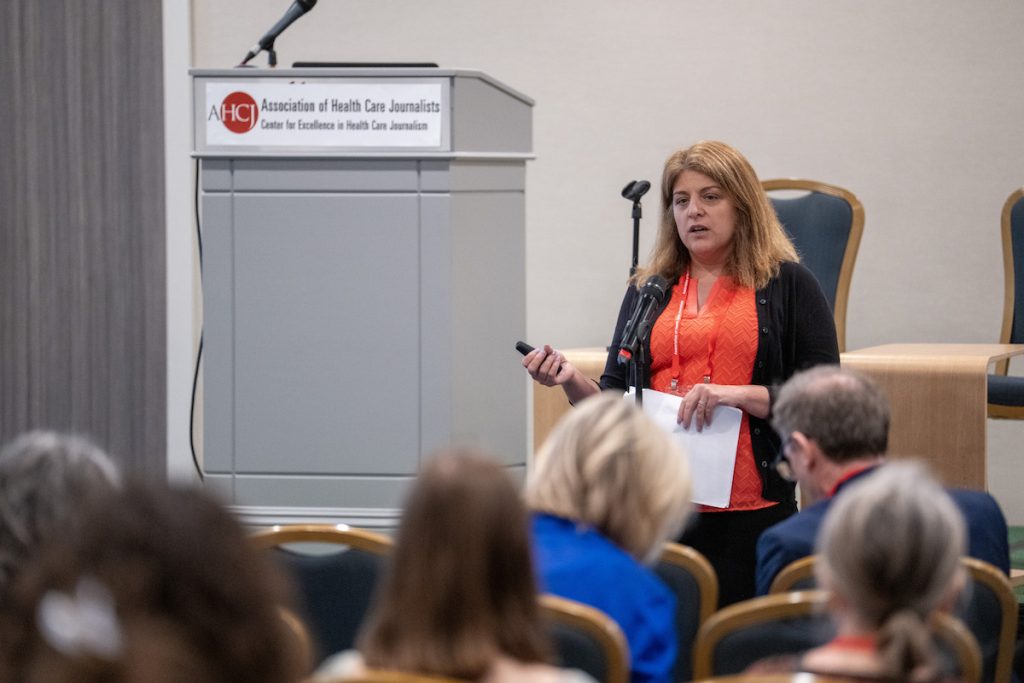 Chrissie Juliano speaks to HJ25 attendees about the impact of vanishing federal funding on local public health