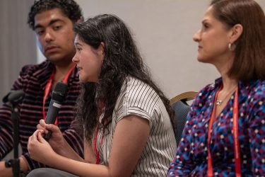 Jasmine Aguilera speaks at an HJ25 panel on documenting the undocumented