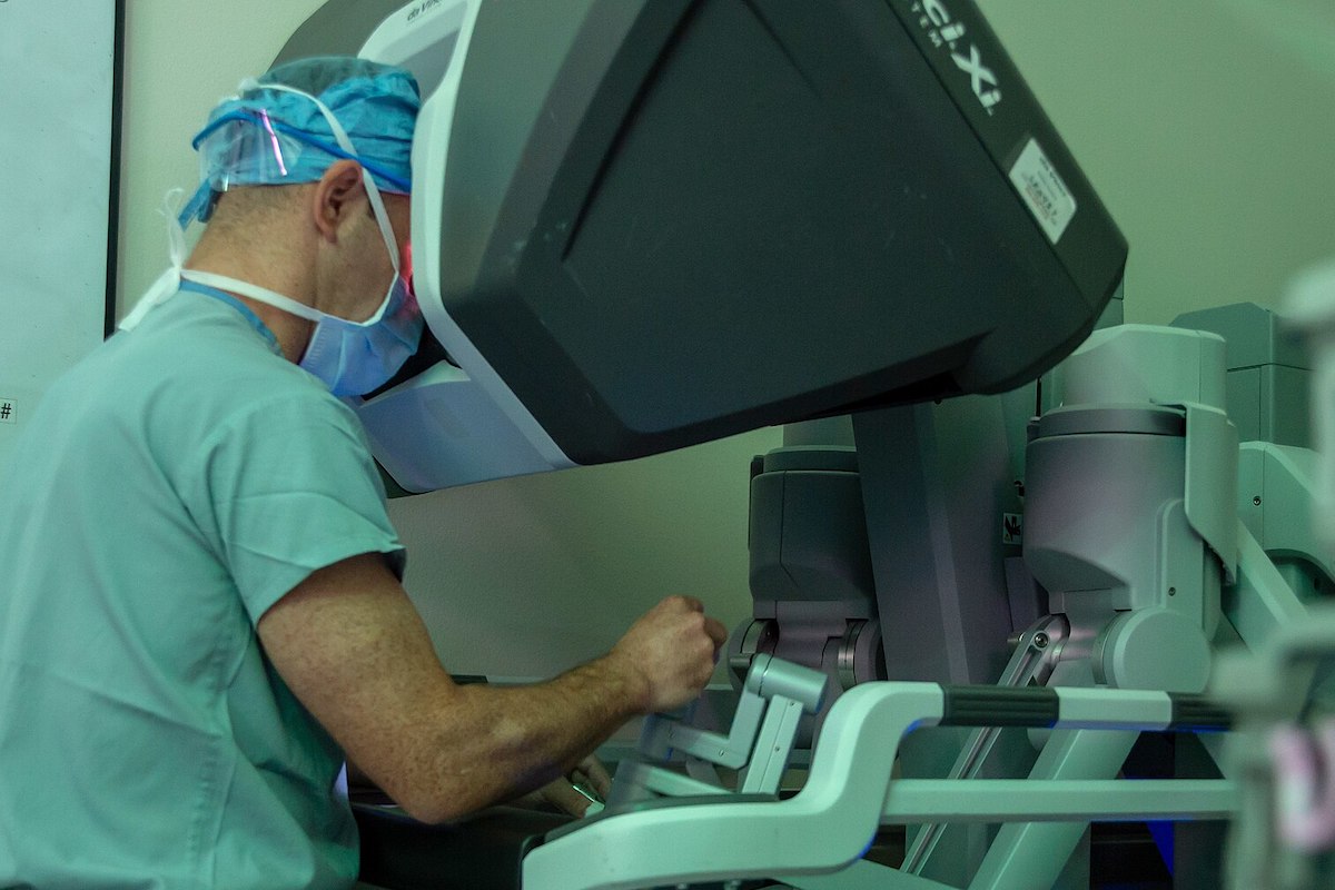 Capt. Sean Stroup, a urologist, uses a robotic surgery system to conduct a pyroplasty procedure. Similar equipment is used in telesurgery.