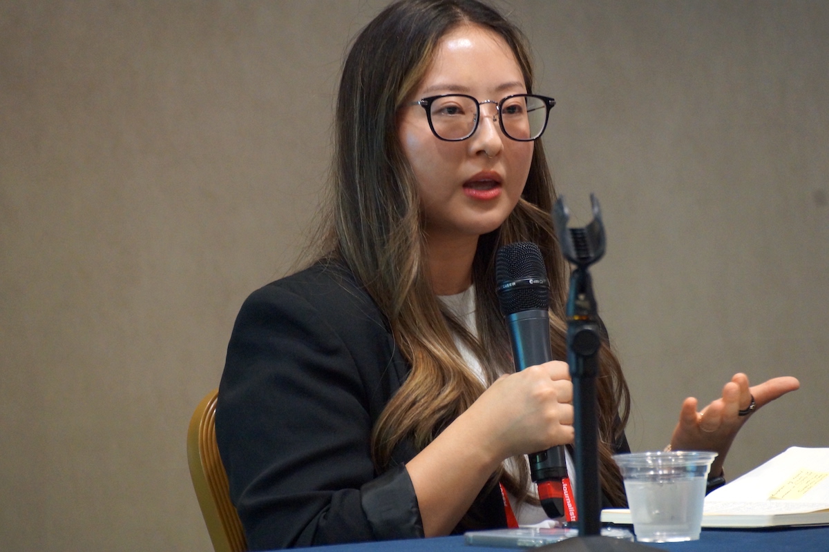 Angela Kim speaks during a panel on domestic violence at HJ25