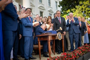 President Donald Trump hammers a gavel after signing the One Big Beautiful Bill Act on the South Lawn of the White House, Friday, July 4, 2025, during the 4th of July picnic.