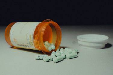 bottle of antidepressants spilling out