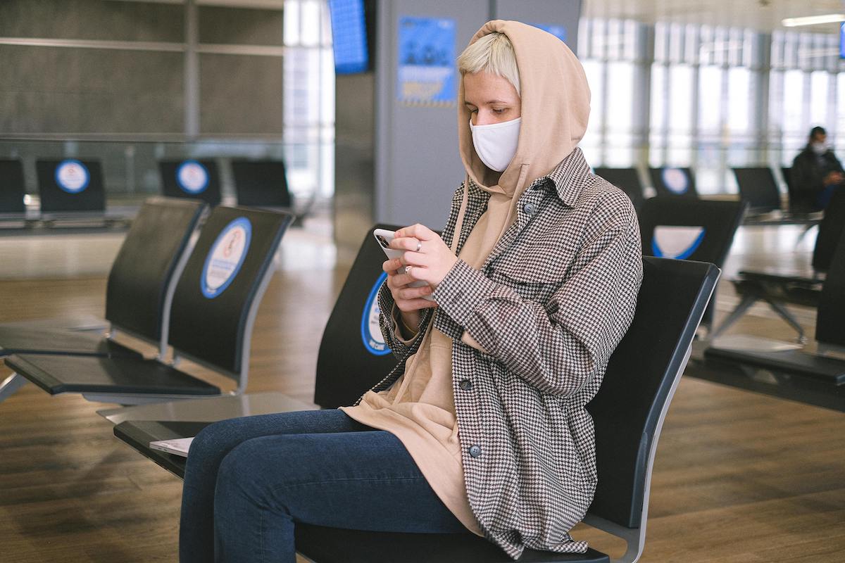 person sitting in airport. telehealth featured image