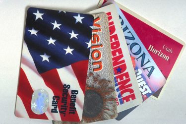 Electronic Benefit Transfer (EBT) cards from different states, used to redeem SNAP benefits
