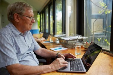an older adult using a computer