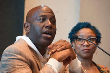 Panelists Terence Muhammad, co-chair of the Greensboro Health Disparities Collaborative (left), and Kristin Z. Black, Ph.D., MPH, assistant professor at the UNC Gillings School of Global Public Health (right), during the session “Promising partnerships for improving health” at AHCJ’s Fall Summit. Photo by Erica Tricarico