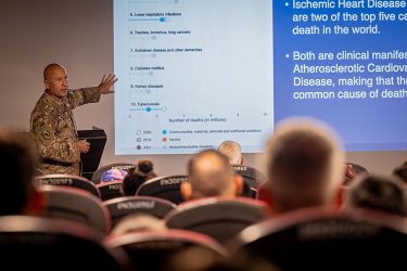 A U.S. service member gives a presentation at an international medical conference at the Expeditionary Medical Facility on Camp Lemonnier.