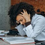 stressed woman at a desk