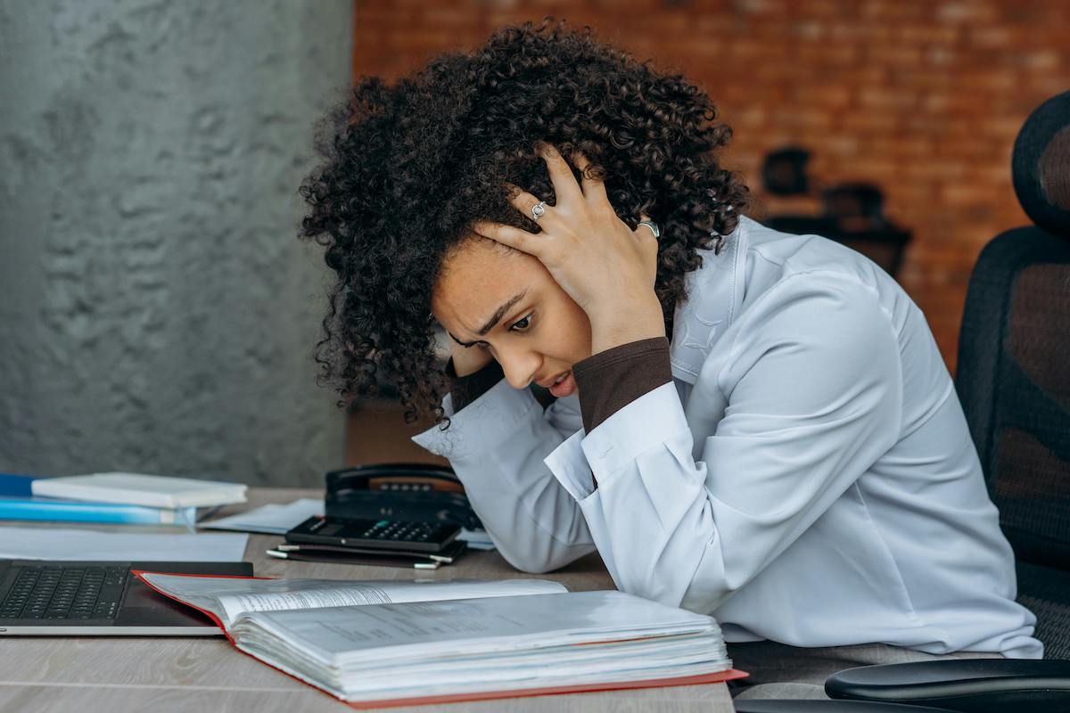 stressed woman at a desk
