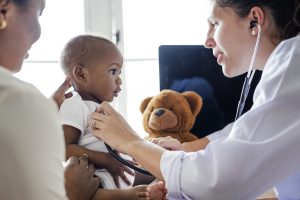 baby visiting the doctor for a checkup. health equity featured image