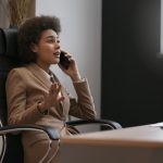 freelance journalist at desk advocating for herself
