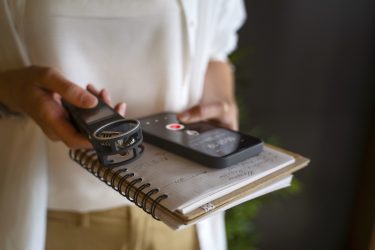 reporter holding a notebook and recording device. pitching featured image