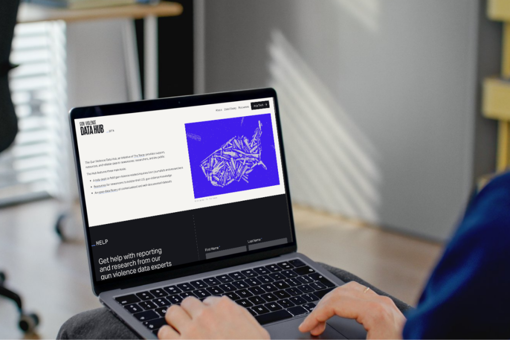 person using a laptop on the Trace's Gun Violence Data Hub site