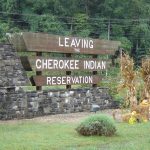 a sign that says "Leaving Cherokee Indian Reservation." Native American health care story featured image