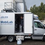 Air pollution chemist Robert Wegener stands in his state-of-the-art mobile air pollution lab, which can measure even the most difficult to detect pollutants such as ultrafine particles at fine scales, even from one street to the next. Wegener’s lab travels all over Germany and Europe to study public health questions about air quality.