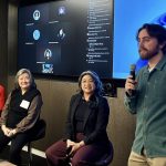 Brennan LaBrie speaks to a room of journalists about workshopping pitching