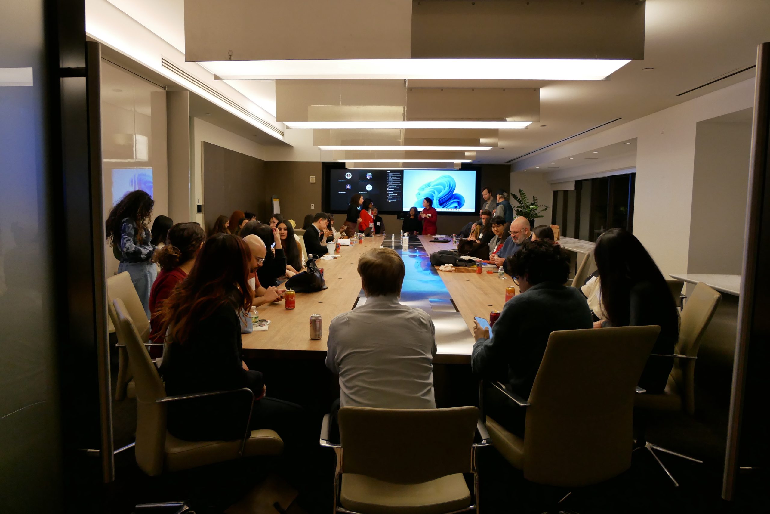 journalists sit around a table