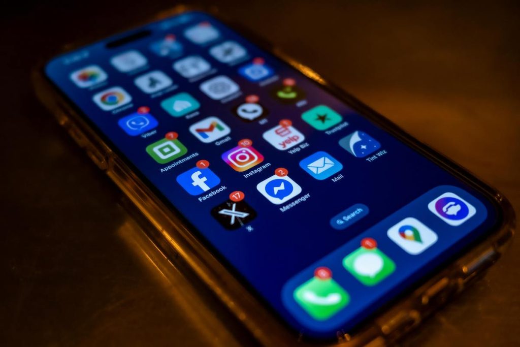 iPhone with multiple social media apps on it