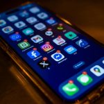 iPhone with multiple social media apps on it
