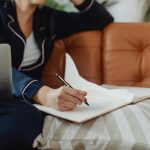 person figuring out how to pitch and ripping pages out of a notebook
