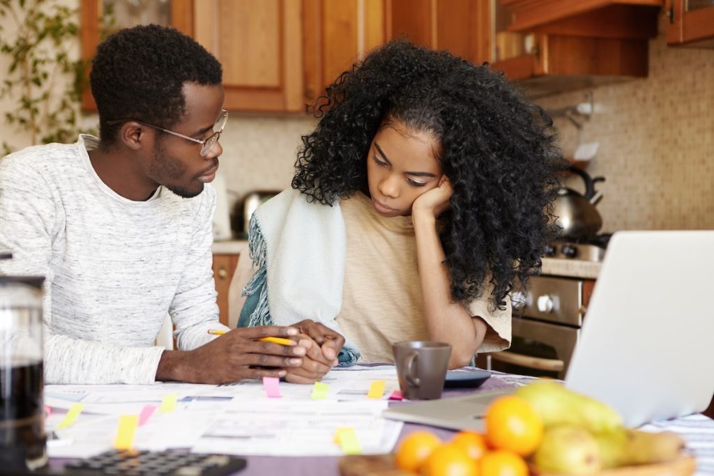 People paying bills high deductible health plan
