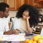 People paying bills high deductible health plan