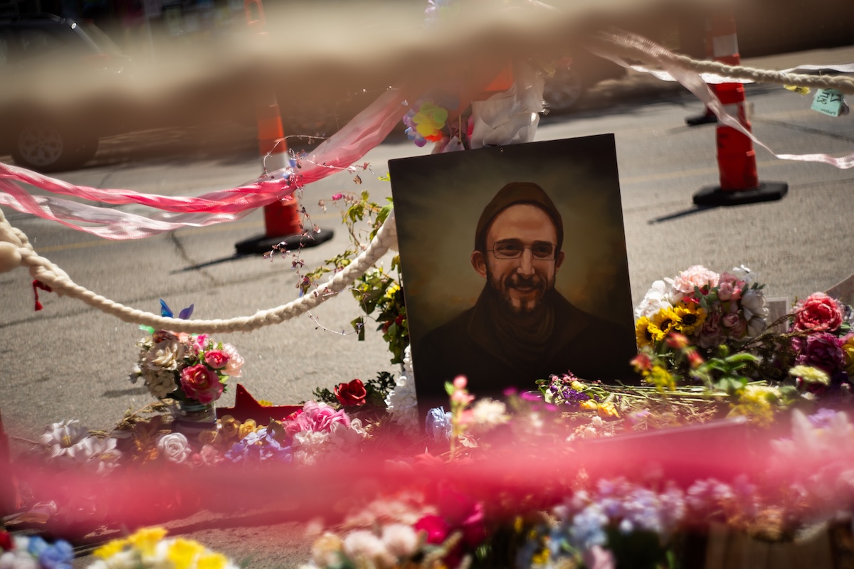 Attendees visited Alex Pretti's memorial on a trip to the field at HJ26. Photo by Zachary Linhares