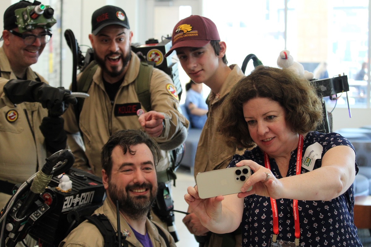 An attendee on the HJ26 field trip to Children's Minnesota takes a selfie with the Ghostbusters. Photo by Kevin Ridder