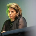 Laudan Y. Aron of The Urban Institute listens during an HJ26 panel titled 'Missing Americans': The U.S. early death epidemic. Photo by Zachary Linhares