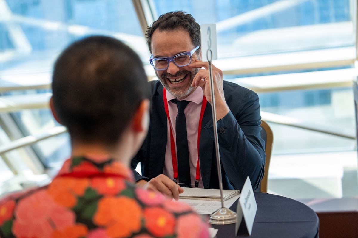 Tradeoffs Founder and Executive Editor listens to a pitch during PitchFest at HJ26. Photo by Zachary Linhares