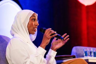 Inspire Change Clinic CEO Munira Maalimisaq speaks during the panel Plenary: The cost of fear: The short- and long-term health consequences of aggressive immigration enforcement 