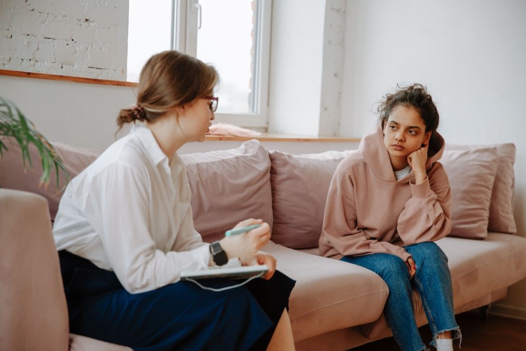 A teenage girl at a therapy session