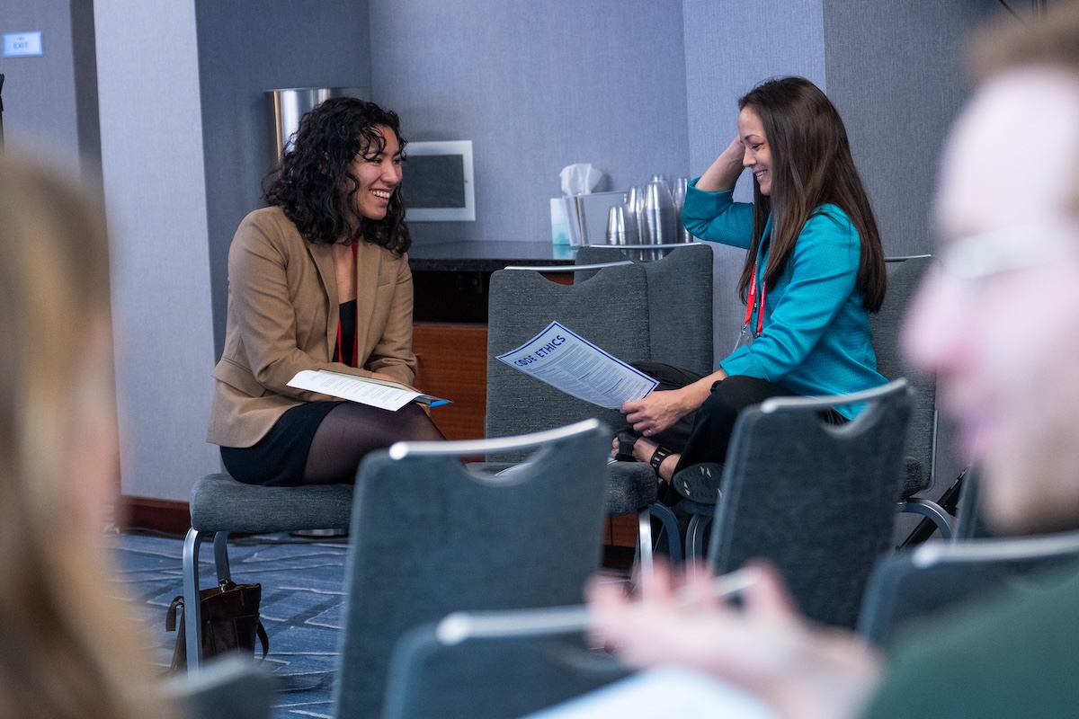 KFF Health News Regional Editor Hayat Norimine, left, talks with AHCJ Board Vice President Christine Herman during the HJ26 session "Better ethical decision-making." Photo by Zachary Linhares