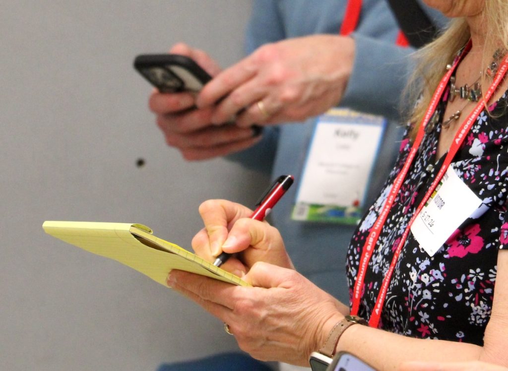 An HJ26 attendee takes notes. Photo by Kevin Ridder