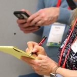 An HJ26 attendee takes notes. Photo by Kevin Ridder