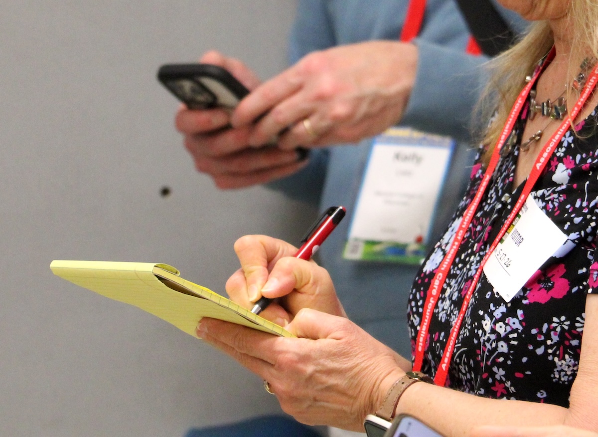 An HJ26 attendee takes notes. Photo by Kevin Ridder
