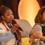 Ericka A. Dixon with the Disability Project at the Transgender Law Center talks at HJ26 about the resurgence of eugenics-coded health policies and products. Photo by Zachary Linhares