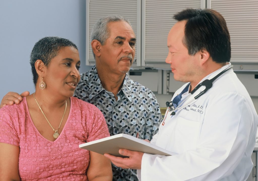 a couple talking to a doctor