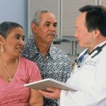 a couple talking to a doctor