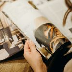 woman reading a magazine that just might be The Atlantic