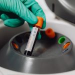 a blood test tube in a centrifuge, similar to the Alzheimer's drug blood test