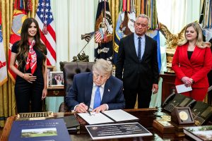 President Trump signing an executive order regarding childhood vaccines in the Oval Office on Aug. 10, 2026.