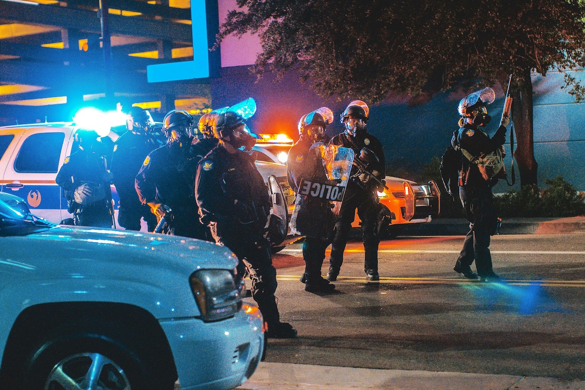 Police and SWAT members in riot gear. The practice of "swatting" hospitals is posing a growing threat.